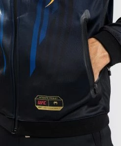 CSD FASHION UFC AUTHENTIC FIGHT NIGHT 2.0 KIT BY VENUM MEN'S WALKOUT HOODIE - Midnight Edition - Champion 21 CSD FASHION UFC AUTHENTIC FIGHT NIGHT 2.0 KIT BY VENUM MEN'S WALKOUT HOODIE - Midnight Edition - Champion -Venum Shop b 252F0 252F7 252F9 252Fb079d5636214746d0e25dd2322c355599f7b3fc6 VNMUFC 14 2 64c348e6 76a9 414c af3e 58b7b4b1ce51